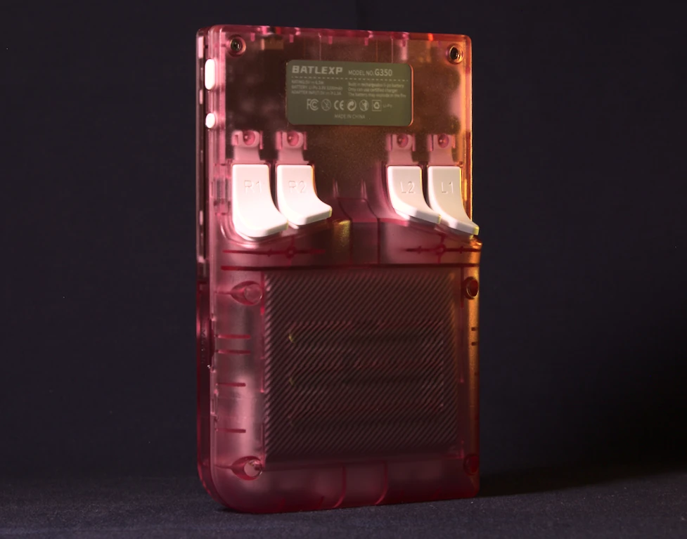 Rear view of the BATLEXP G350 in Transparent Pink showing the L1, L2, R1, and R2 shoulder trigger buttons alongside the product information label